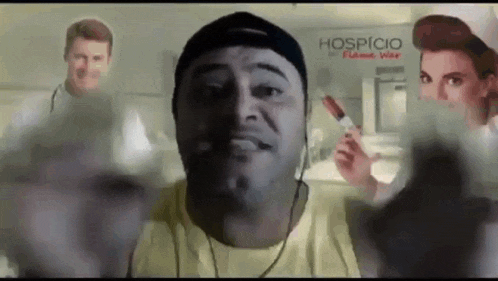 a man is holding a syringe in front of a sign that says hospital .