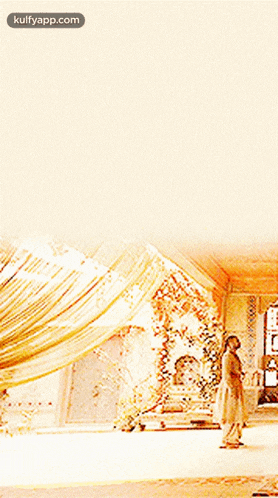 a woman in a dress is standing in a room with a curtain behind her ..