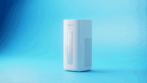 a white air purifier on a blue background with colorful shapes