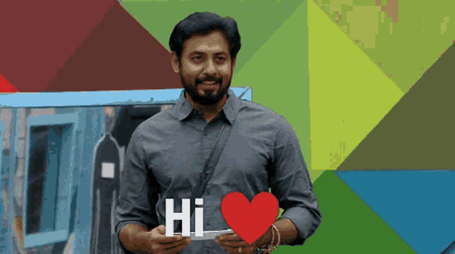 a man with a beard is holding a sign that says hi