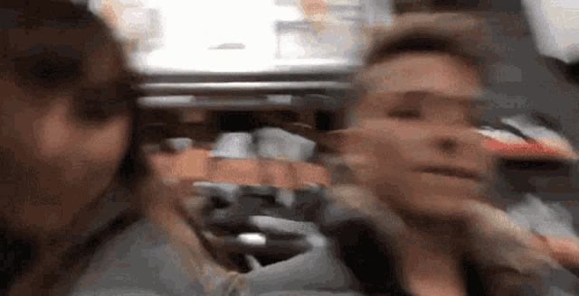 a blurry picture of a man and a woman looking at each other