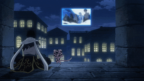 a man sits on a balcony watching a movie