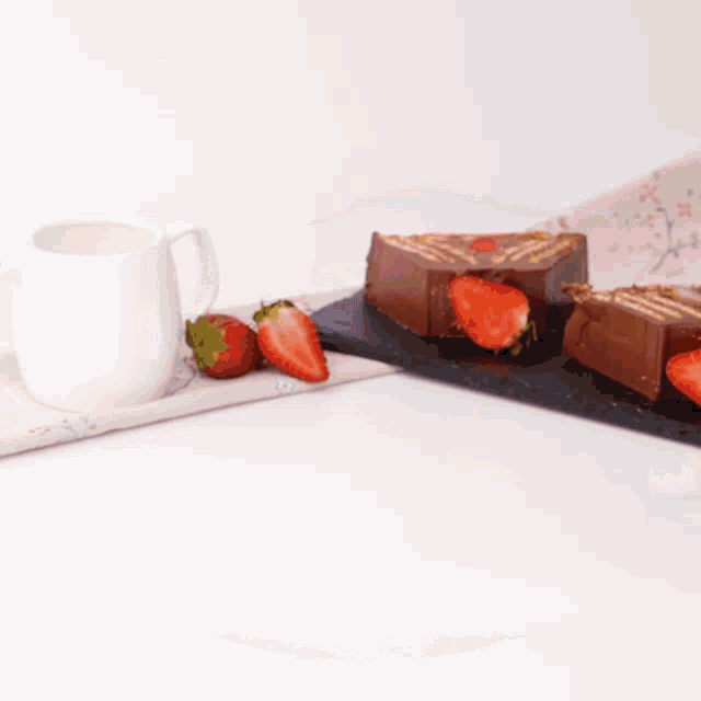 a piece of chocolate cake with strawberries on it