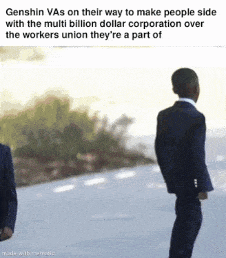 a man in a suit is standing next to another man in a suit on the side of a road .