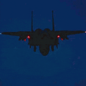 a fighter jet is flying through a dark blue sky at night with smoke coming out of its wings .