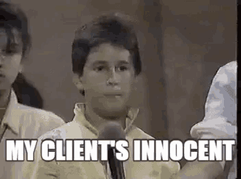 a young boy is standing in front of a microphone with the words `` my client 's innocent '' written above him .