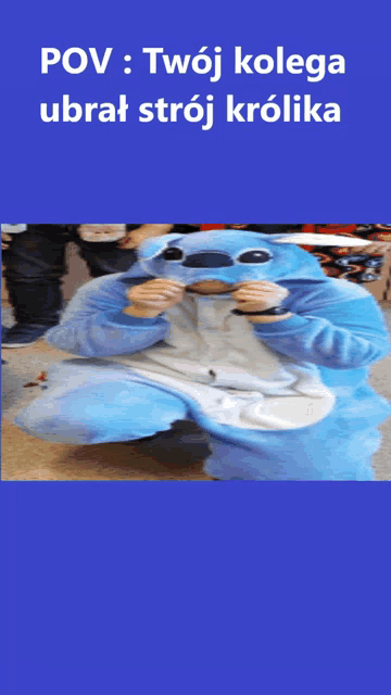 a person in a stitch costume is kneeling down on the floor