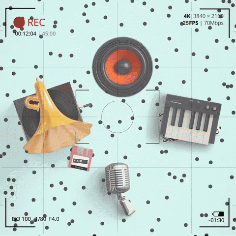 a recording of a record player a microphone and a keyboard is being recorded in 4k