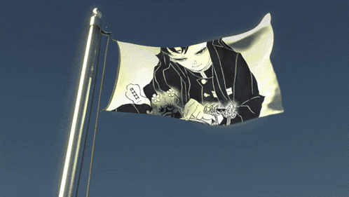 a white flag with a picture of a man on it is flying in the wind
