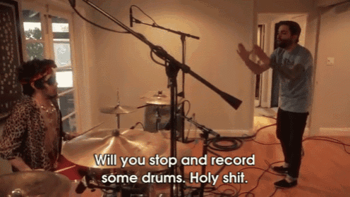 a man playing drums with the words " will you stop and record some drums holy shit " below him
