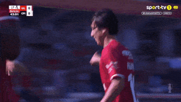 a soccer player in a red jersey with the number 10 on it