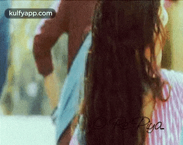 a close up of a woman 's hair with the words kulfyapp.com in the corner .
