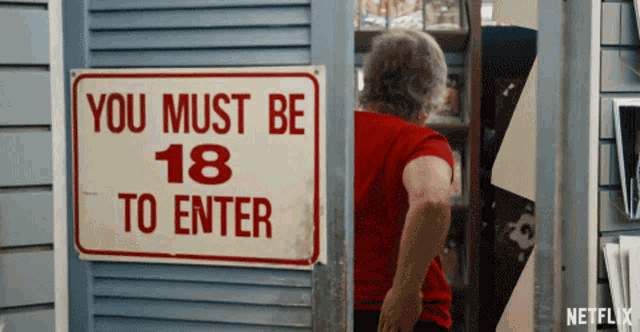 a sign that says " you must be 18 to enter " on it