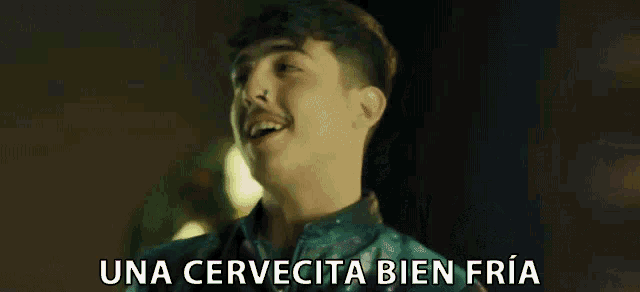 a man in a green jacket says una cervecita bien fria