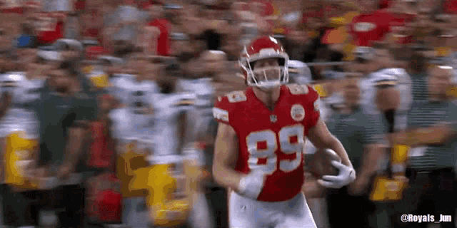 a football player wearing a red jersey with the number 89 on it