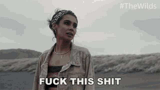 a woman says fuck this shit while standing in the desert
