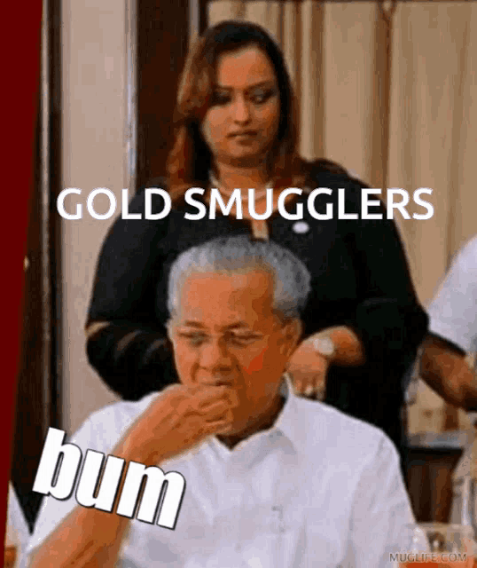 a man sitting at a table with a woman behind him and the words gold smugglers bum written on the bottom