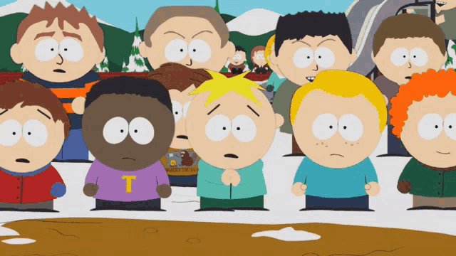 a group of south park characters standing next to each other with one wearing a shirt with the letter t on it