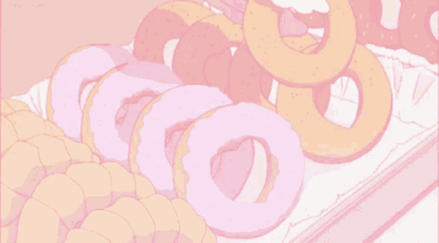a bunch of donuts are sitting on top of each other on a tray .