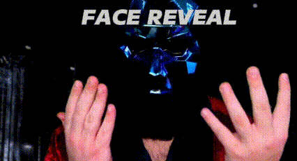 a man in a red robe has blood on his face and the words face reveal are behind him