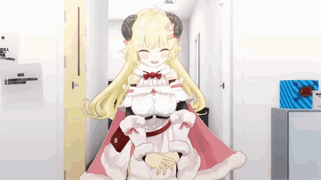 a girl with horns is standing in a hallway and smiling
