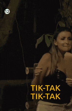 a woman in a black top with the words tik-tak tik-tak