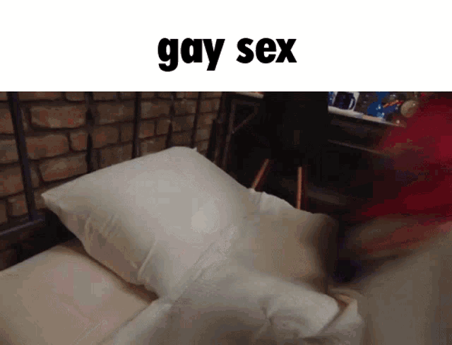 a person laying on a bed with the words gay sex written above them