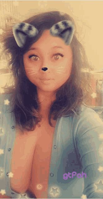 a woman taking a selfie with a cat filter on her face and the words gtpoh on the bottom