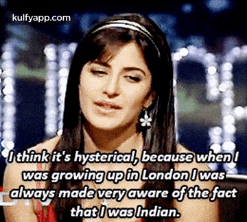 a woman is wearing a headband and earrings and talking about growing up in london .
