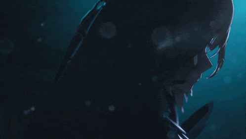 a woman in a dark room with a blue background