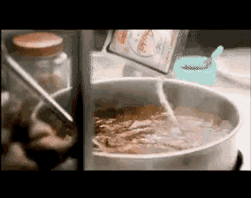 a bowl of soup is being poured into a container