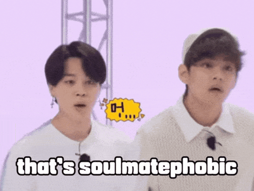 two men are standing next to each other and one of them says that 's soulmatephobic .