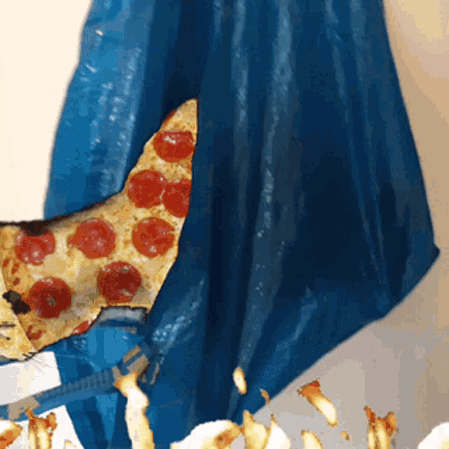 a slice of pepperoni pizza is in a blue bag