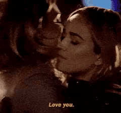 a man and a woman are looking at each other and the man says i love you