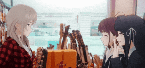 three anime girls are standing in a store talking to each other