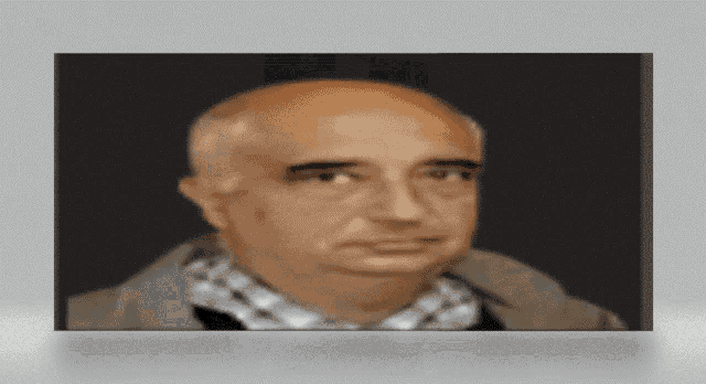 a bald man wearing a plaid shirt and a jacket