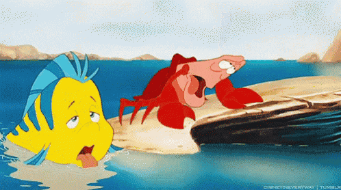 a yellow fish and a red lobster from the little mermaid are in the water