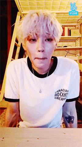 a person wearing a canadian rockies dream t-shirt