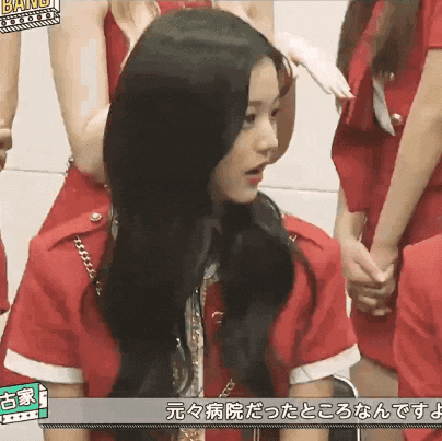 a girl in a red uniform with the word bang on the bottom right