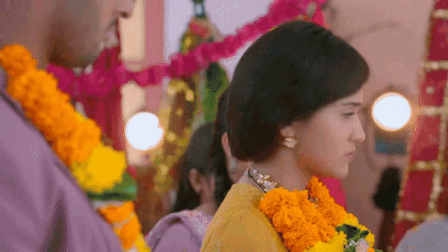 a man and a woman are standing next to each other at a wedding ceremony