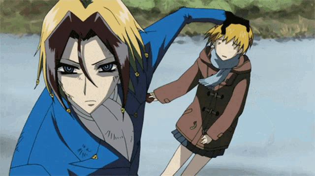 a man in a blue jacket holds a girl 's hand