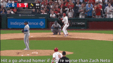 a baseball game is being played in front of a citizens bank park banner