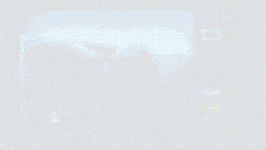 a camera screen shows a person laying on a bed with awb written on it