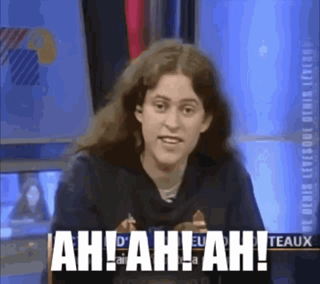 a woman with long hair says ah ! ah ! ah ! on a tv screen