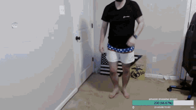 a man is dancing in a room with an american flag in the background