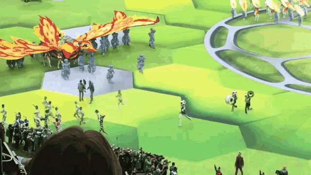 a group of people are gathered in a field with a dragon flying over them