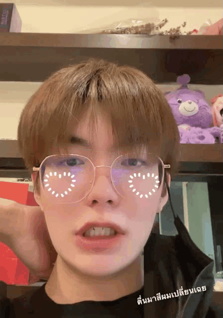 a close up of a person wearing glasses with a heart on them