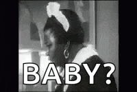 a black and white photo of a woman wearing a maid 's hat and saying `` baby ? ''