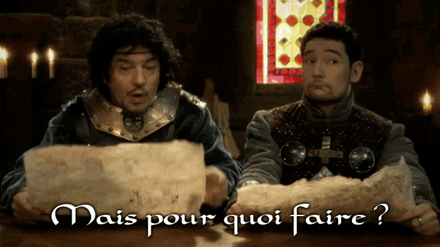 two men looking at a piece of paper with the words mais pour quoi faire written on it