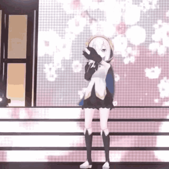 a 3d anime girl is standing on a stage holding a microphone and singing into it .
